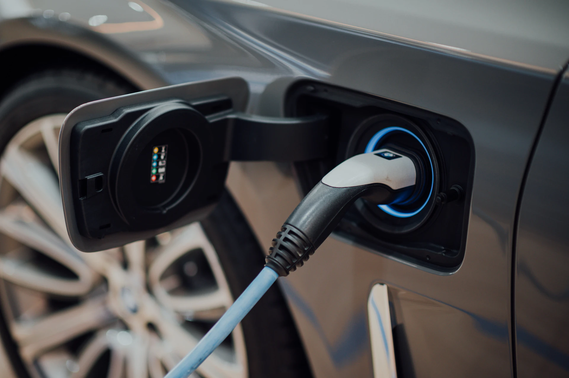 Electric vehicle charging port being serviced by an EV mechanic in Toronto