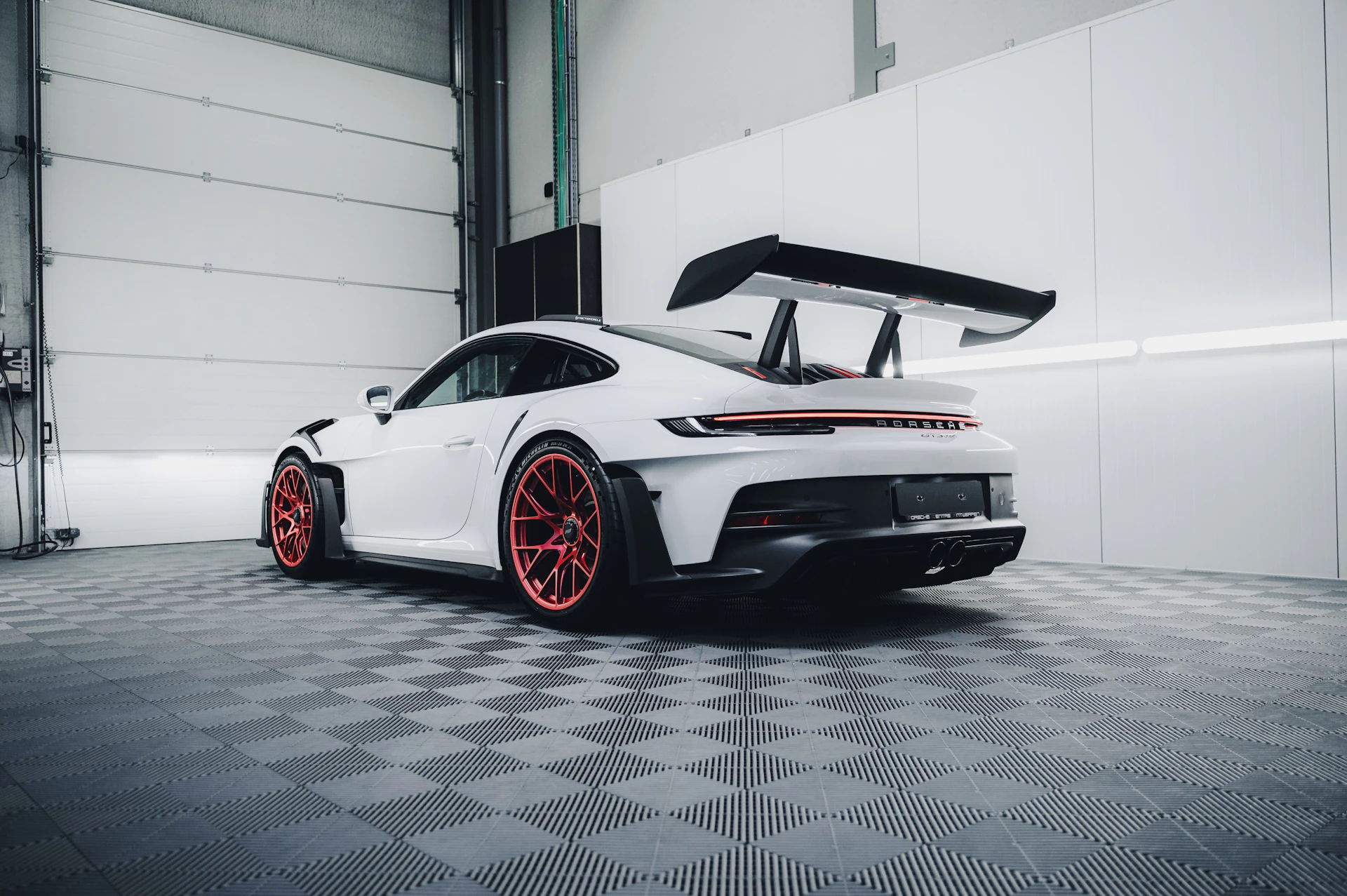 White Porsche 911 GT3 RS in a Toronto auto repair shop garage