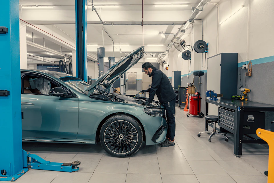 Mechanic servicing a Mercedes-Benz in a Toronto car repair shop