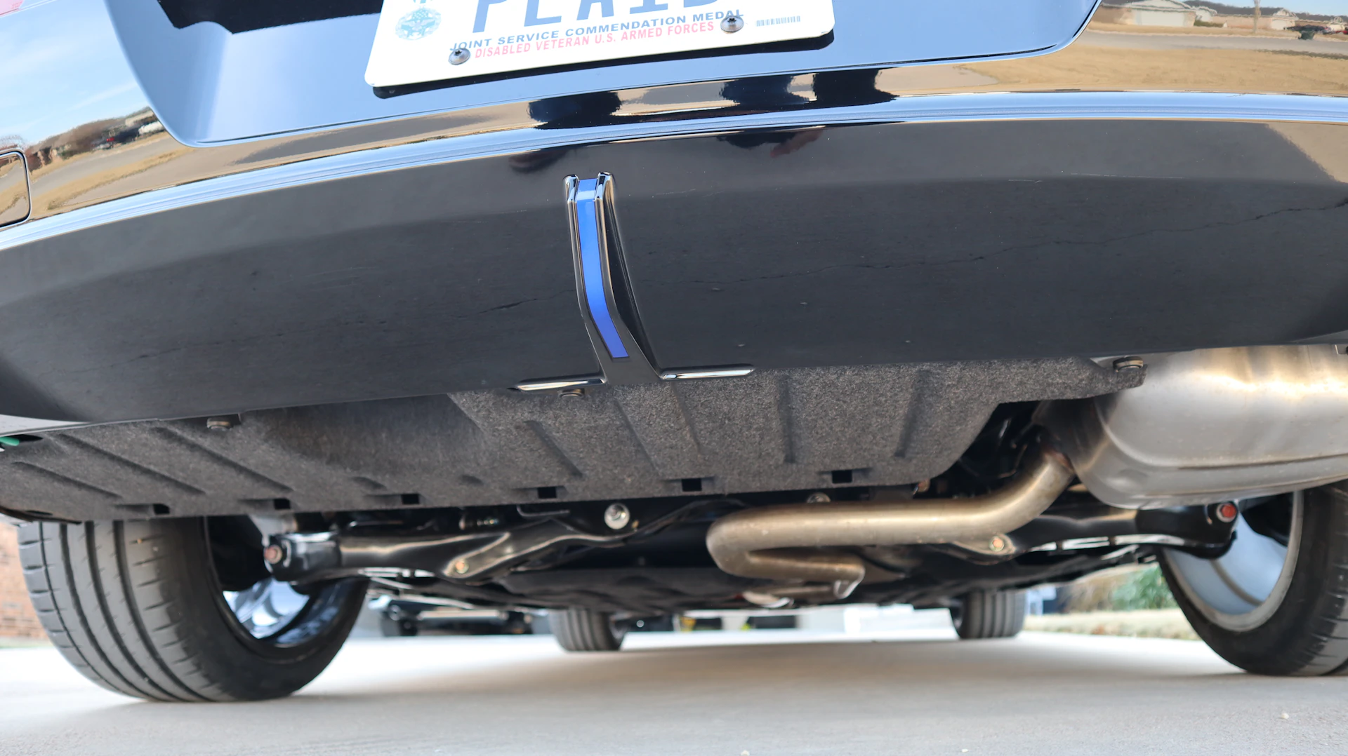 Underbody and chassis view during a salvage vehicle inspection in Ontario